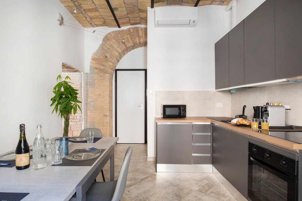 Kitchen beside the brick arch