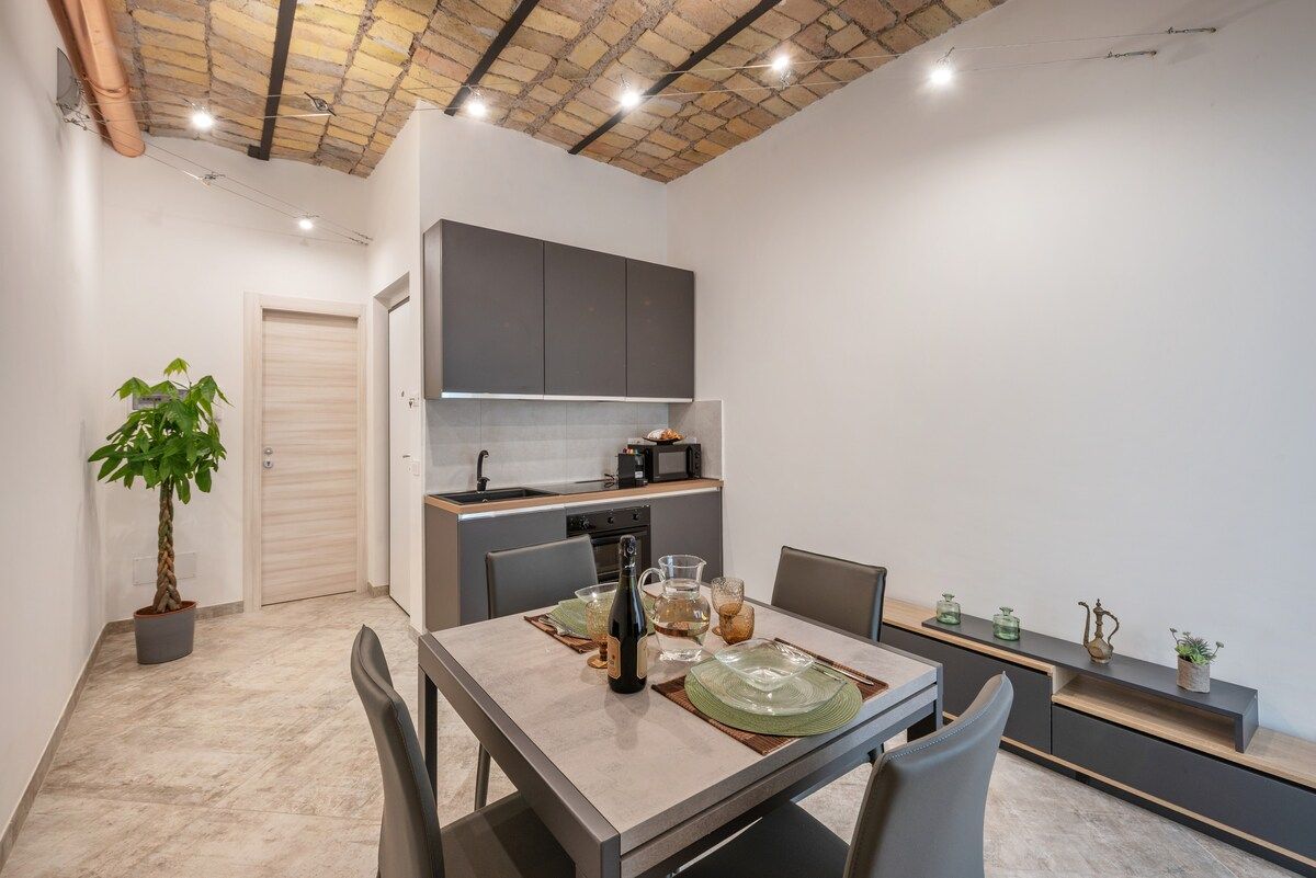 Dining table under the exposed brick vault